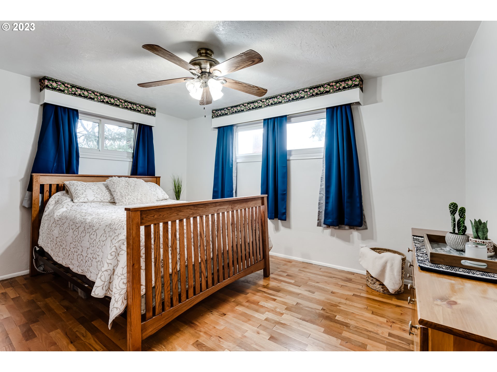 959 Laurelhurst Drive Eugene, OR 97402 - Photo 15 of 30 a bedroom with a bed and a chandelier