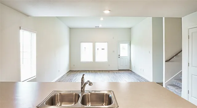 a view of an empty room and window