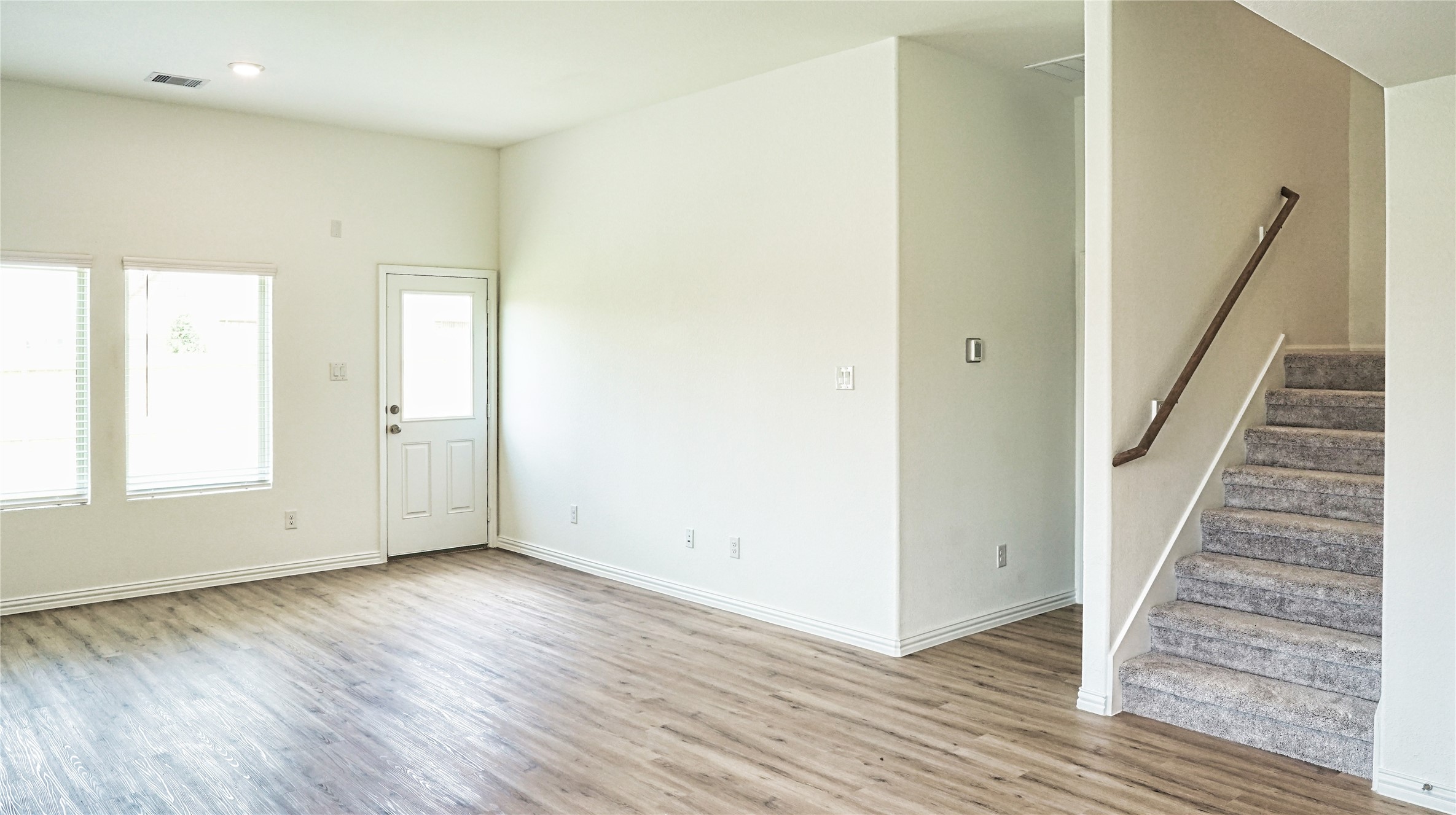 3358 Avary River Lane Rosenberg, TX 77471 - Photo 8 of 22 wooden floor in an empty room with a window