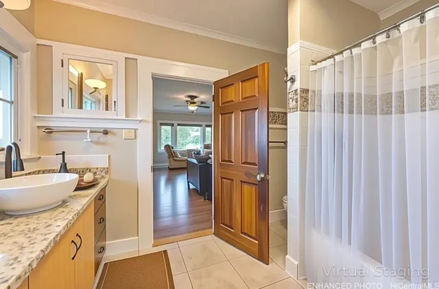 a kitchen with granite countertop a refrigerator and a sink