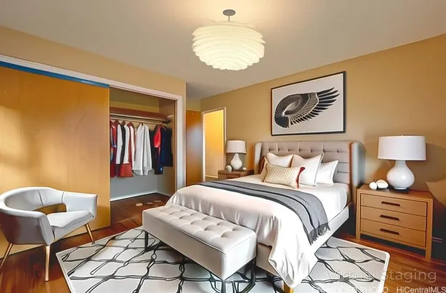 a bedroom with a bed and a chair in it