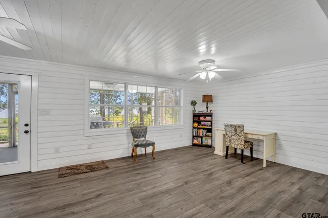 a view of a livingroom with furniture and wooden floor