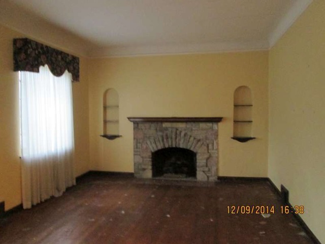 315 Selborne Road Riverside, IL 60546 - Photo 4 of 22 a living room with a fireplace