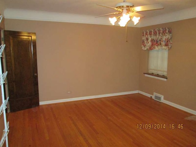 315 Selborne Road Riverside, IL 60546 - Photo 9 of 22 a view of an empty room with a window