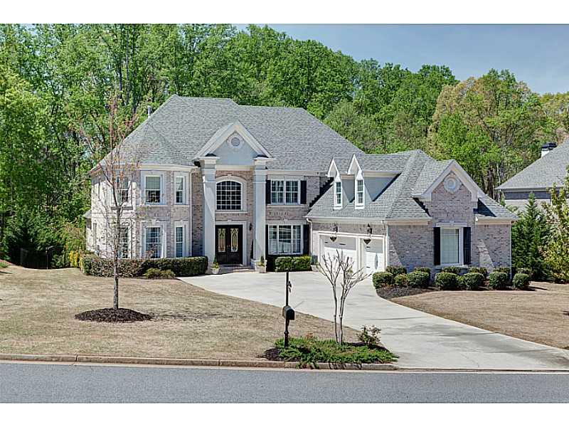 6505 Tulip Plantation Road Alpharetta, GA 30004 - Photo 1 of 1 Exterior Front. Four side white brick European Style home.
