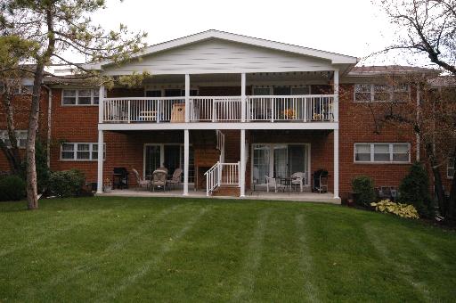 169 East Palatine Road, Unit N Palatine, IL 60067 - Photo 1 of 1 a front view of a house with a yard