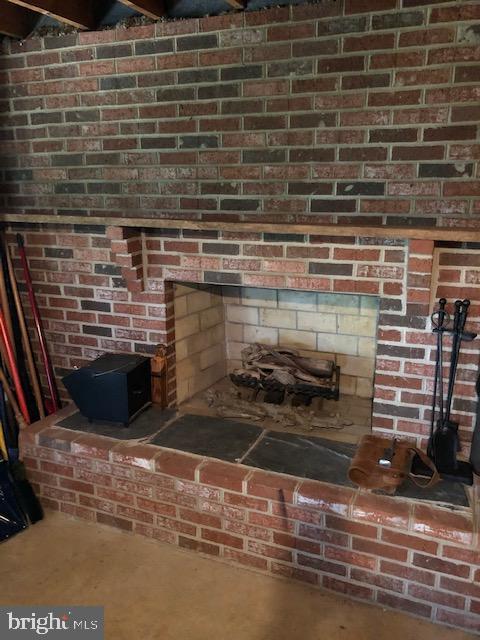 2841 Allspice Road Port Republic, MD 20676 - Photo 13 of 14 Brick fireplace in the unfinished basement.