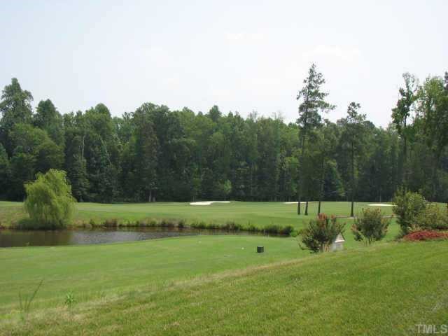 9012 Winged Thistle Court Raleigh, NC 27617 - Photo 3 of 12 This is also the view from the deck. Notice the wooded buffer beyond the course.