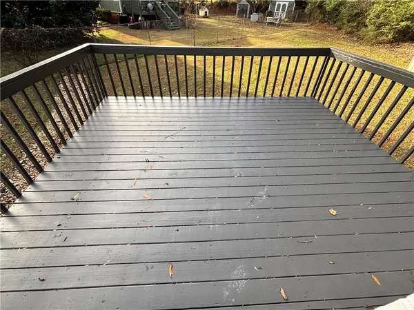a view of a balcony with wooden floor