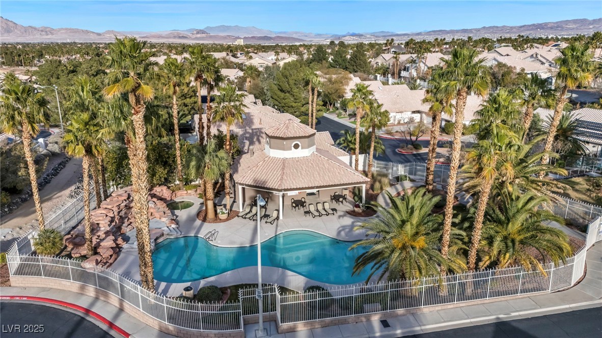 2107 Eaglepath Circle Henderson, NV 89074 - Photo 23 of 84 Aerial view of property and surrounding area featuring mountains and a pool area