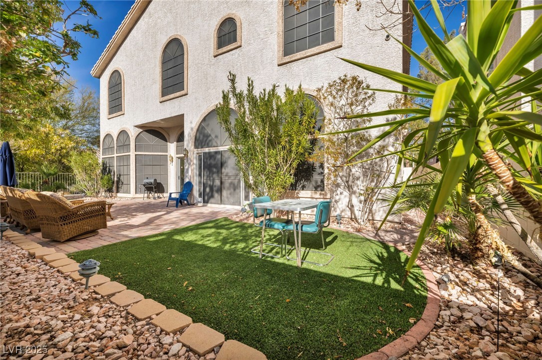 2107 Eaglepath Circle Henderson, NV 89074 - Photo 60 of 84 Back of house featuring stucco siding and a patio