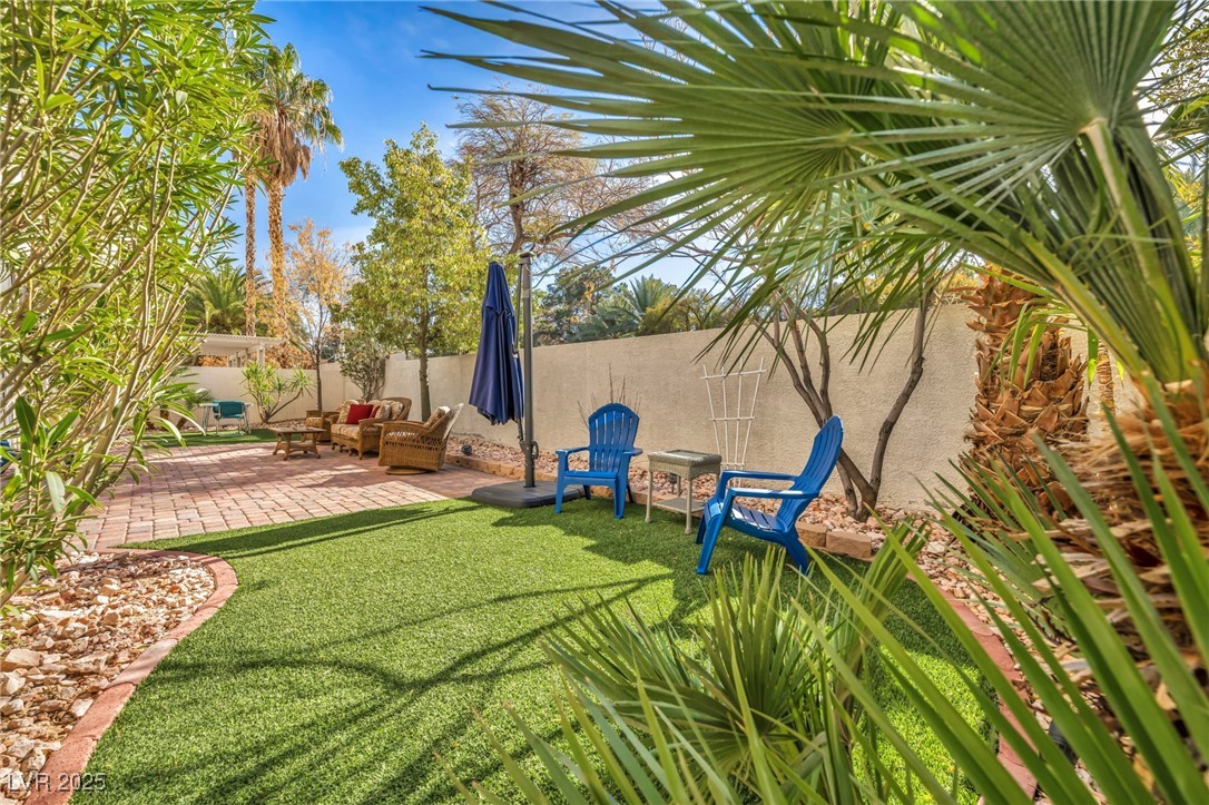 2107 Eaglepath Circle Henderson, NV 89074 - Photo 78 of 84 Fenced backyard featuring a patio area and an outdoor living space