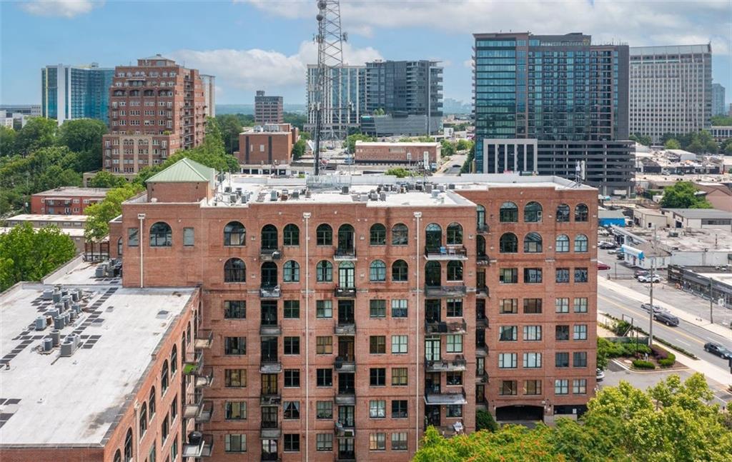 3235 Roswell Road Northeast, Unit 702 Atlanta, GA 30305 - Photo 9 of 16 a large building with a street