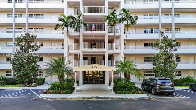 a living room with furniture and large window