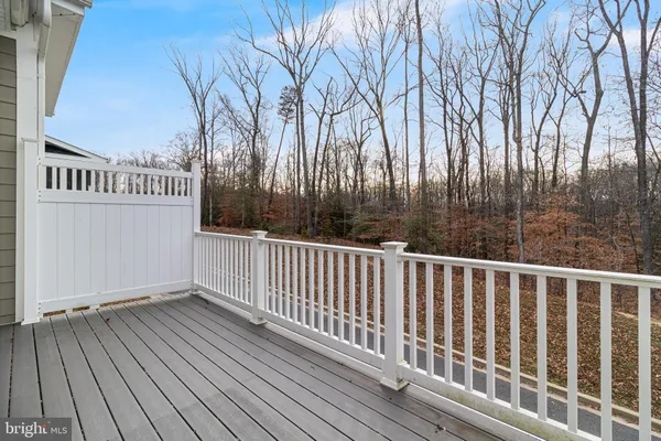 a view of balcony with wooden floor