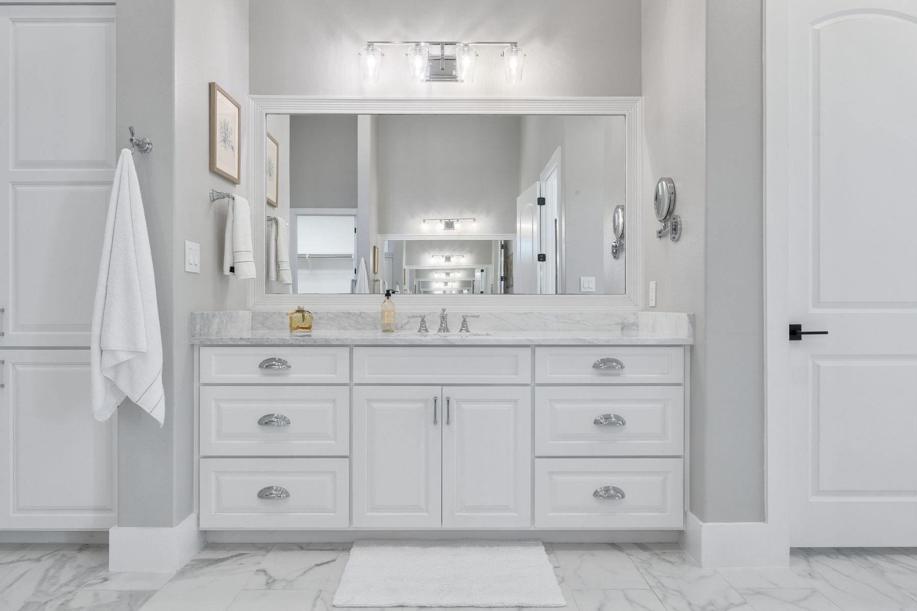 496 Primo Fiore Terrace Austin, TX 78738 - Photo 14 of 40 a bathroom with a sink vanity and mirror