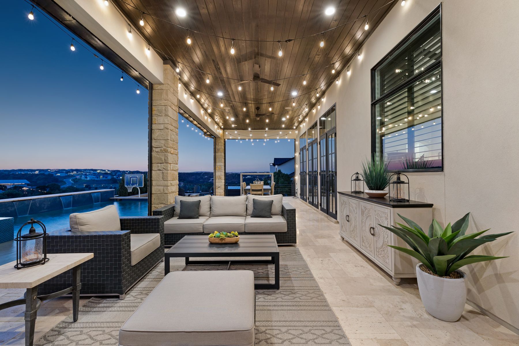 496 Primo Fiore Terrace Austin, TX 78738 - Photo 20 of 40 a living room with furniture and a potted plant