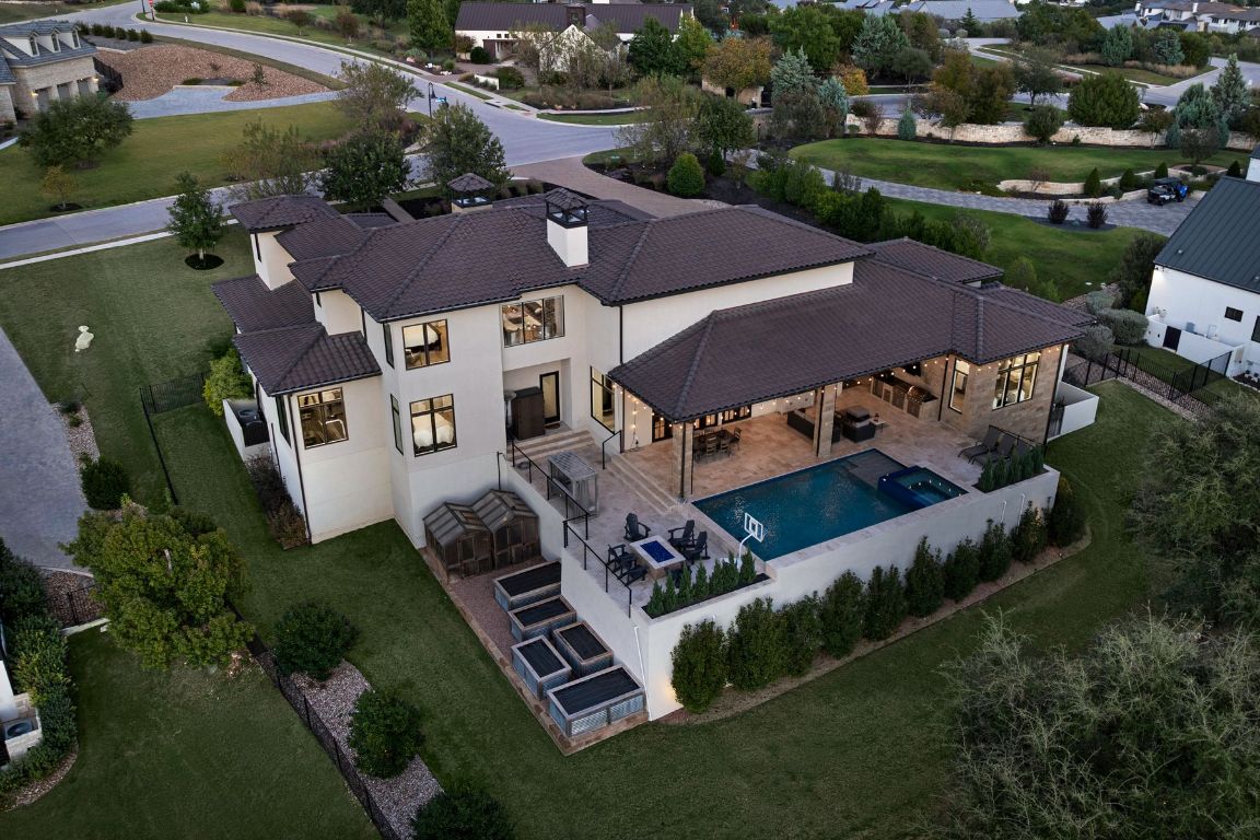 496 Primo Fiore Terrace Austin, TX 78738 - Photo 24 of 40 an aerial view of a house with a garden