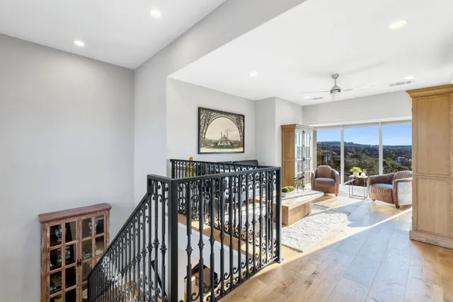 a view of a hallway with furniture and window