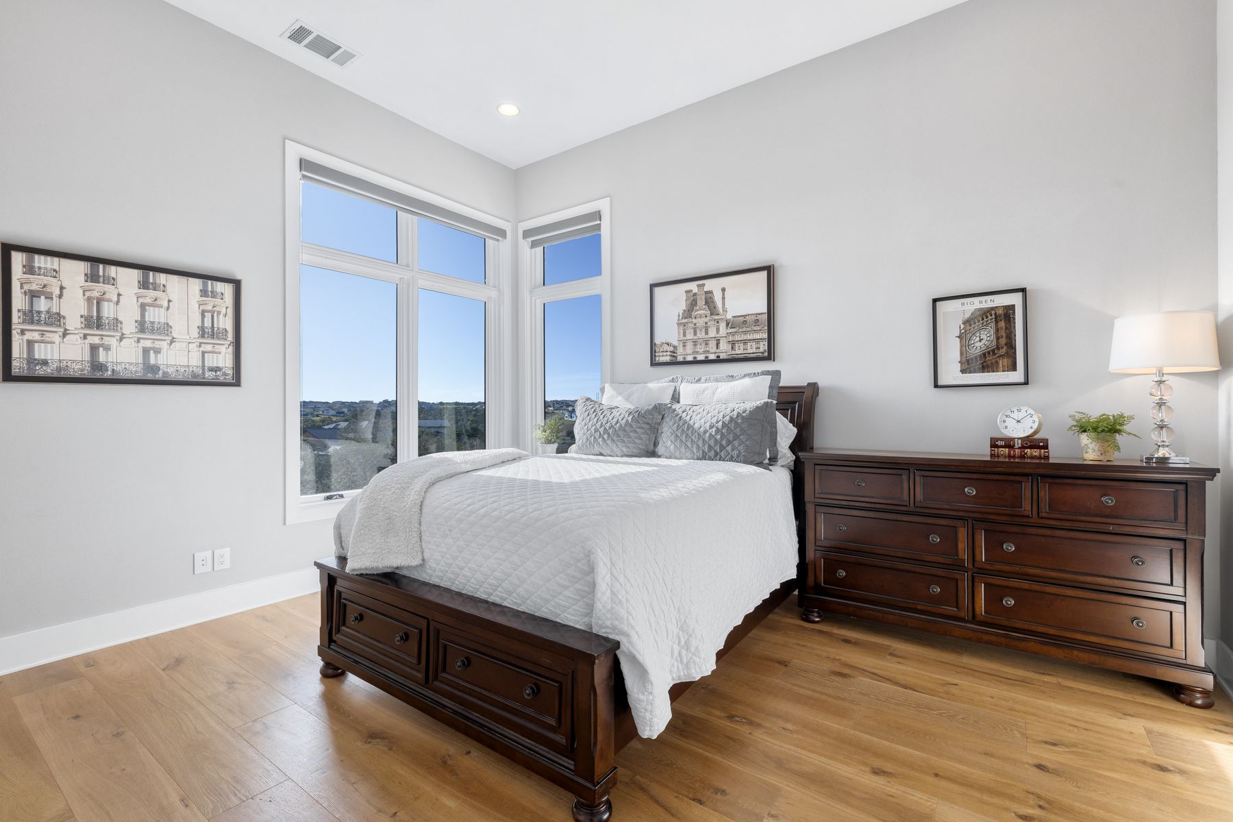 496 Primo Fiore Terrace Austin, TX 78738 - Photo 30 of 40 a bedroom with a bed and a night stand