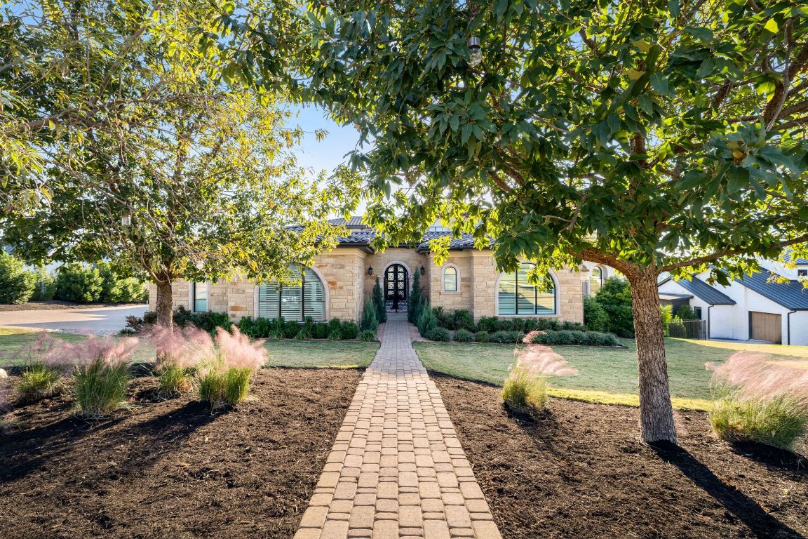 496 Primo Fiore Terrace Austin, TX 78738 - Photo 5 of 40 a view of a pathway with a yard