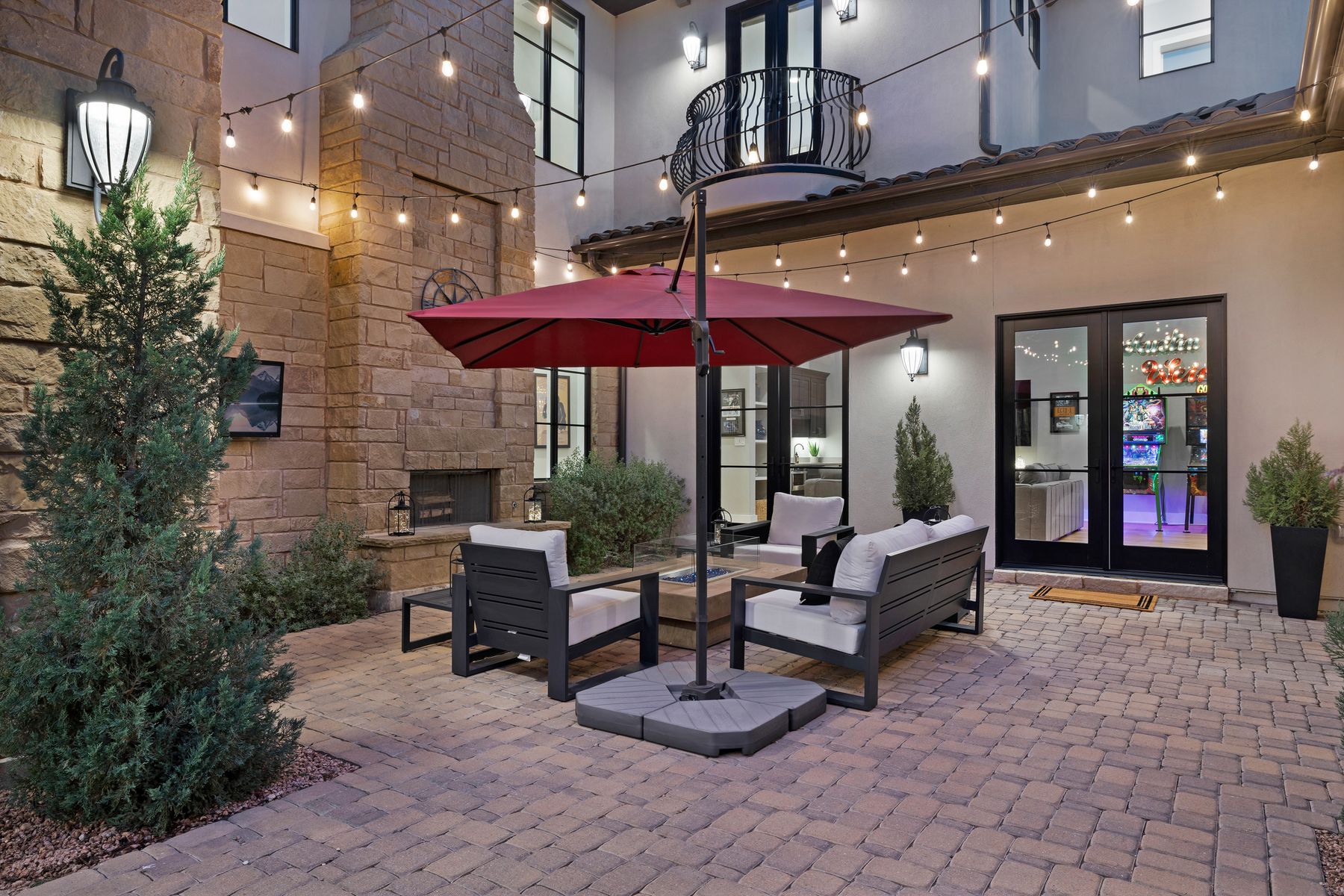 496 Primo Fiore Terrace Austin, TX 78738 - Photo 7 of 40 a building outdoor space with patio furniture and potted plants