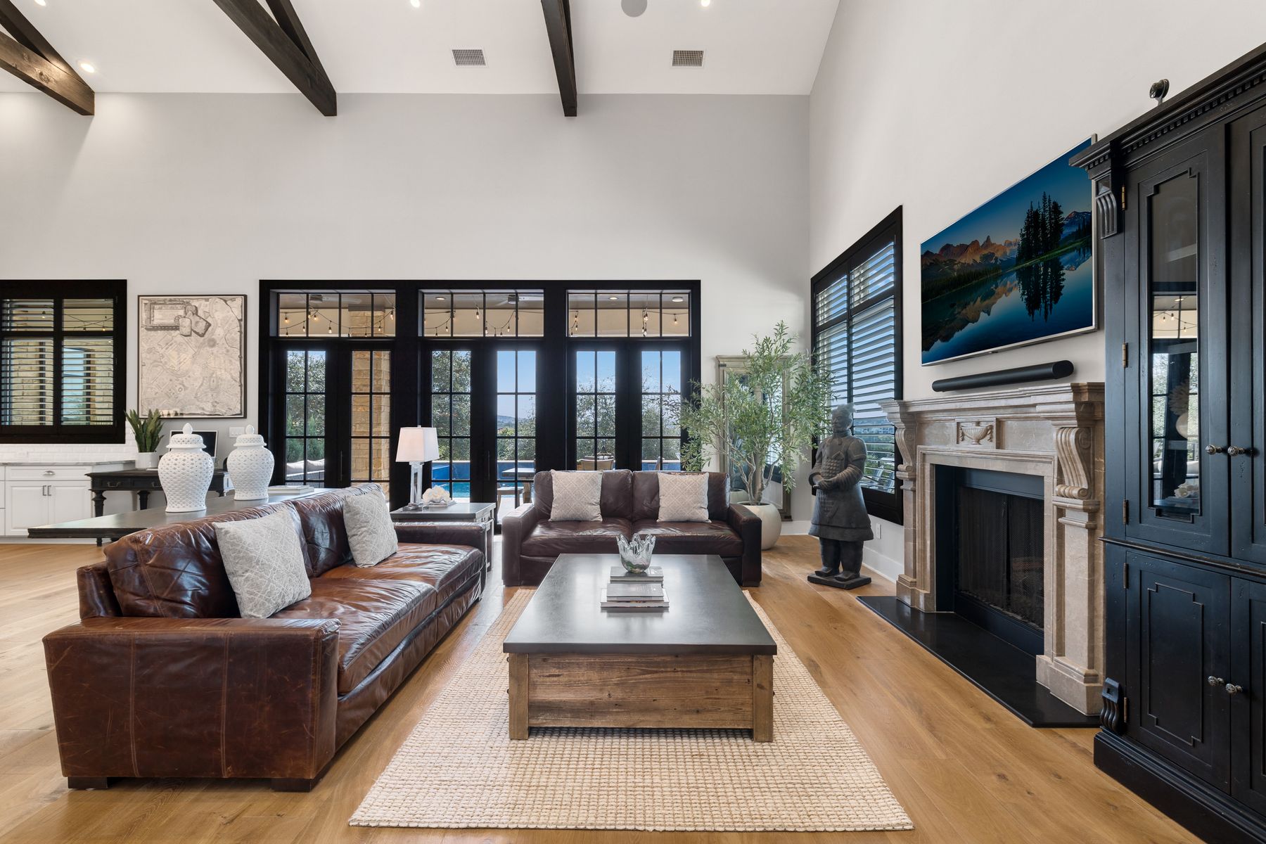 496 Primo Fiore Terrace Austin, TX 78738 - Photo 8 of 40 a living room with furniture fireplace and flat screen tv