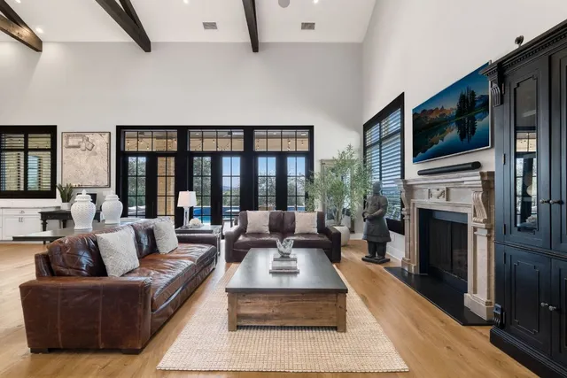 a living room with furniture fireplace and flat screen tv