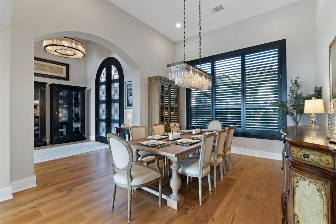 496 Primo Fiore Terrace Austin, TX 78738 - Photo 9 of 40 a dining room with furniture and window