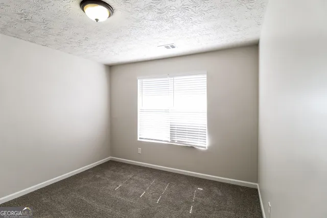 a bathroom with a toilet sink and shower