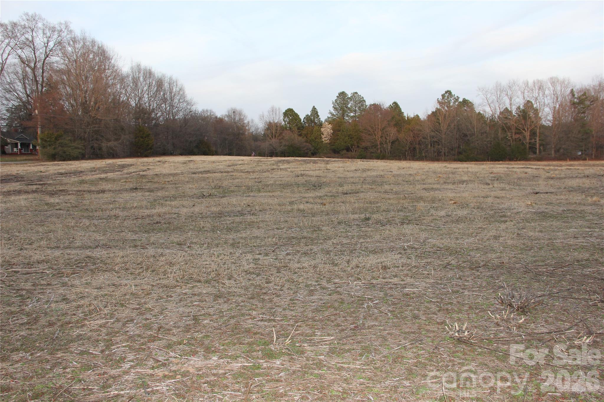 6310 Pagemont Road Kannapolis, NC 28081 - Photo 16 of 19 a view of a field with trees in the background