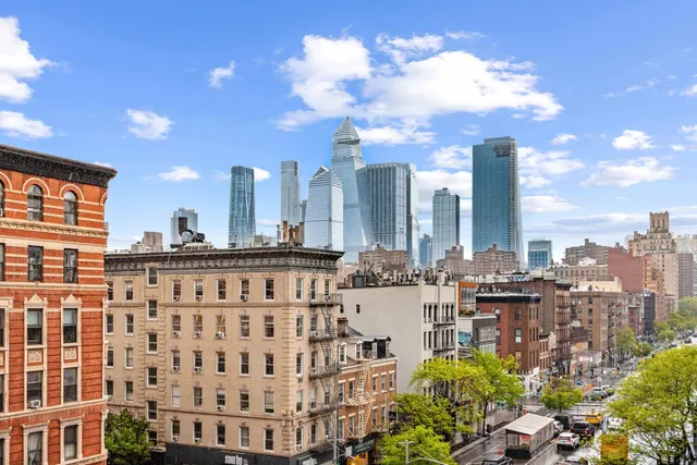 a view of a city with tall buildings