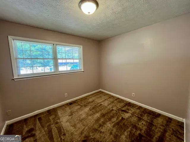 a view of a room with a window