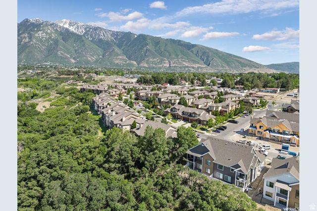 1429 Chateau Ridge Way Sandy, UT 84092 - Photo 21 of 22 Aerial perspective showcasing a residential community with snow-capped mountains in the background