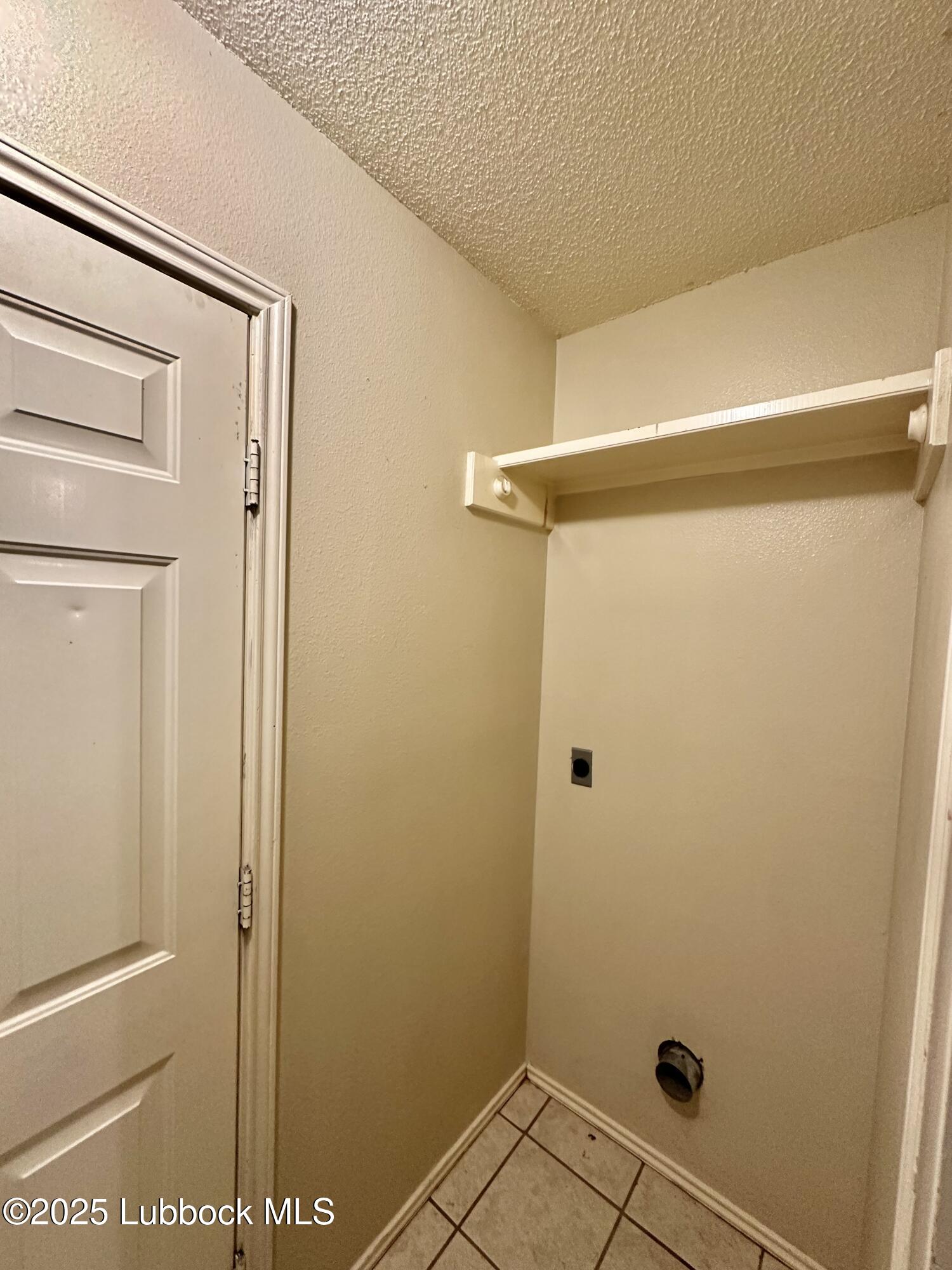 222 Grover Avenue Lubbock, TX 79416 - Photo 11 of 14 a bathroom with a glass shower door