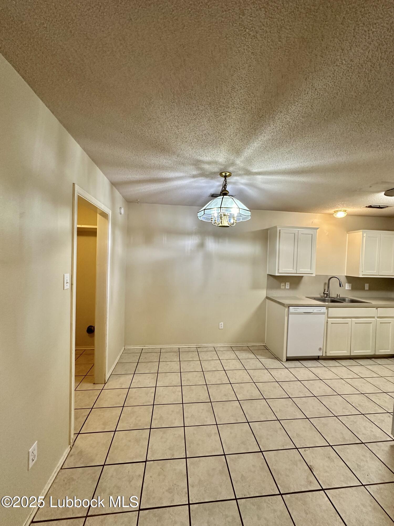 222 Grover Avenue Lubbock, TX 79416 - Photo 5 of 14 a view of a kitchen with a sink and cabinets