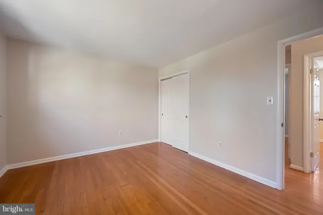 a kitchen with a refrigerator stove and white cabinets