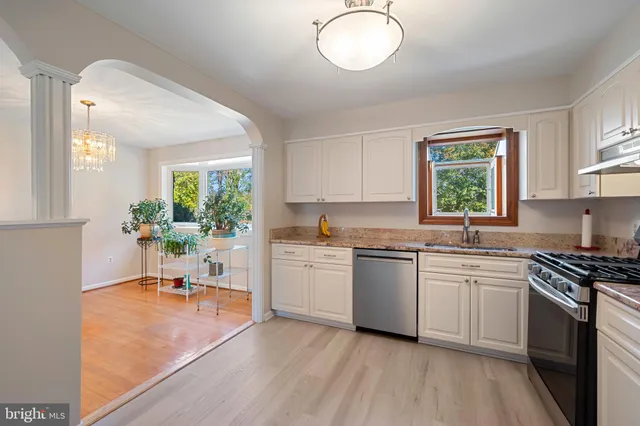 a bathroom with a sink mirror and toilet