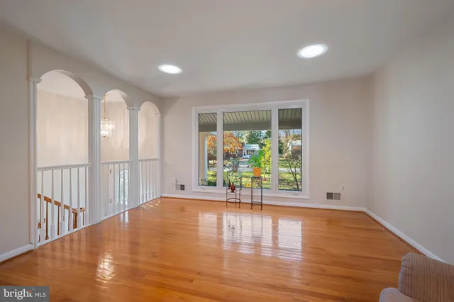 an empty room with windows and closet