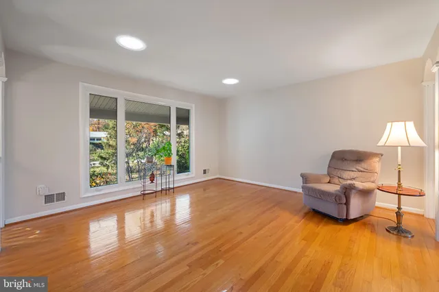 a view of a roof deck with wooden floor and city view