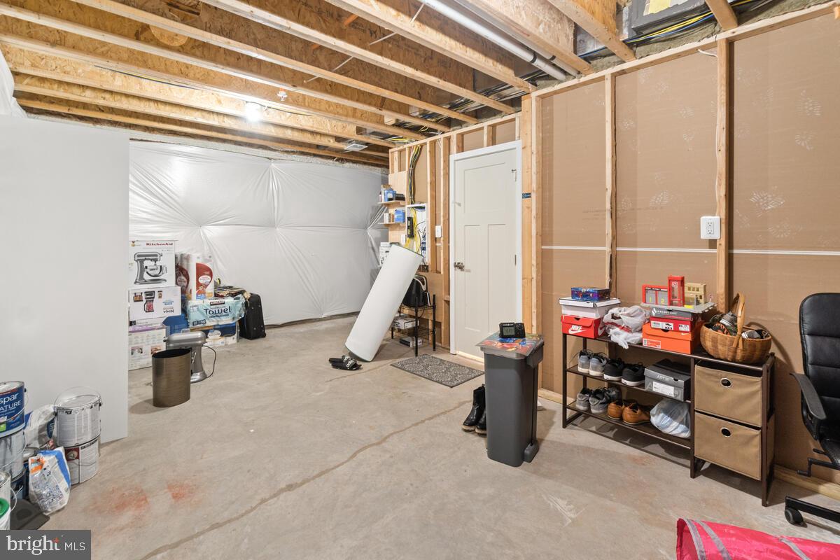 4798 Hiteshow Drive Frederick, MD 21703 - Photo 31 of 51 Unfinished Portion of Basement with Bath Rough In