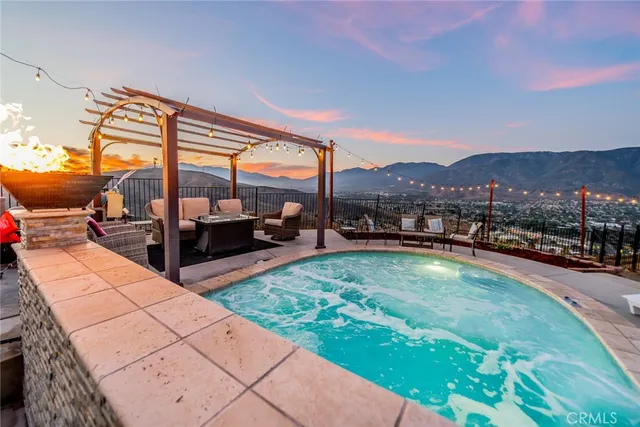 a view of swimming pool with a patio