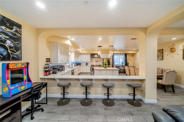 a view of a a dining room with furniture window and wooden floor