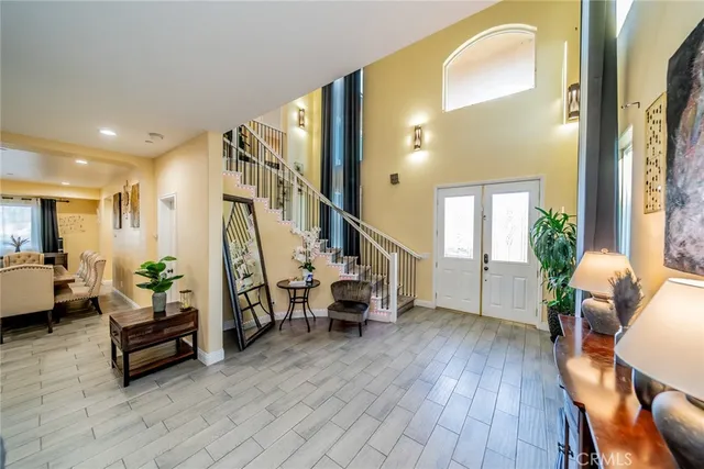 a kitchen with stainless steel appliances granite countertop a refrigerator sink and stove