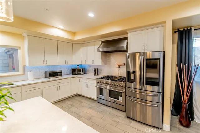a utility room with closet dryer and washer