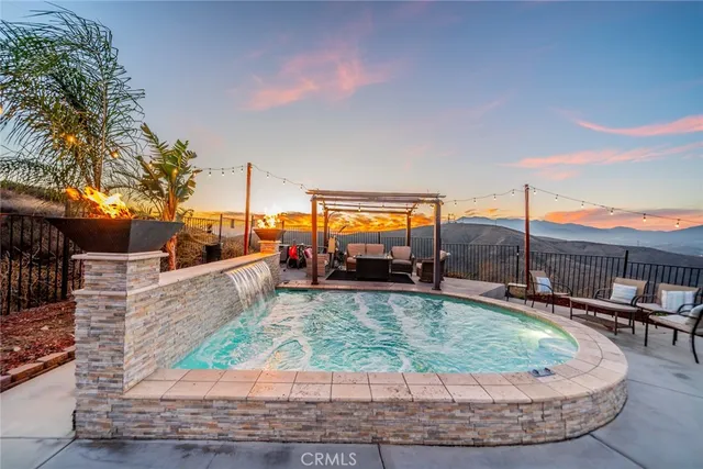 a view of a swimming pool with a patio