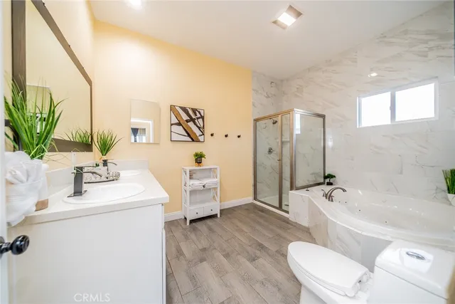 a bathroom with a sink a toilet and tub