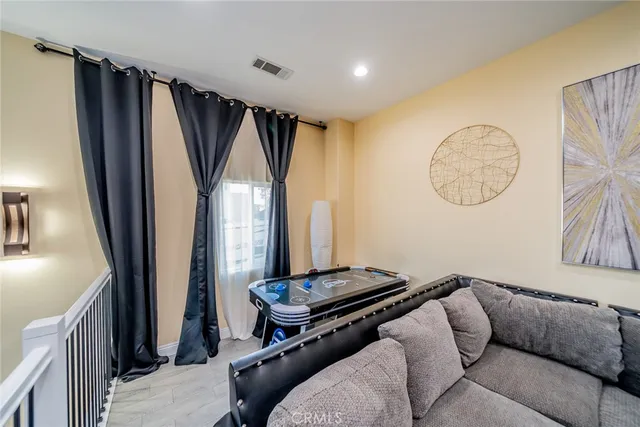 a bedroom with furniture and a flat screen tv