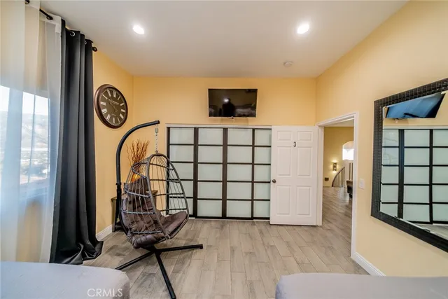 a view of a livingroom with furniture and a window