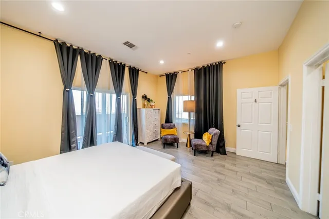 a bathroom with a granite countertop sink toilet a mirror and shower